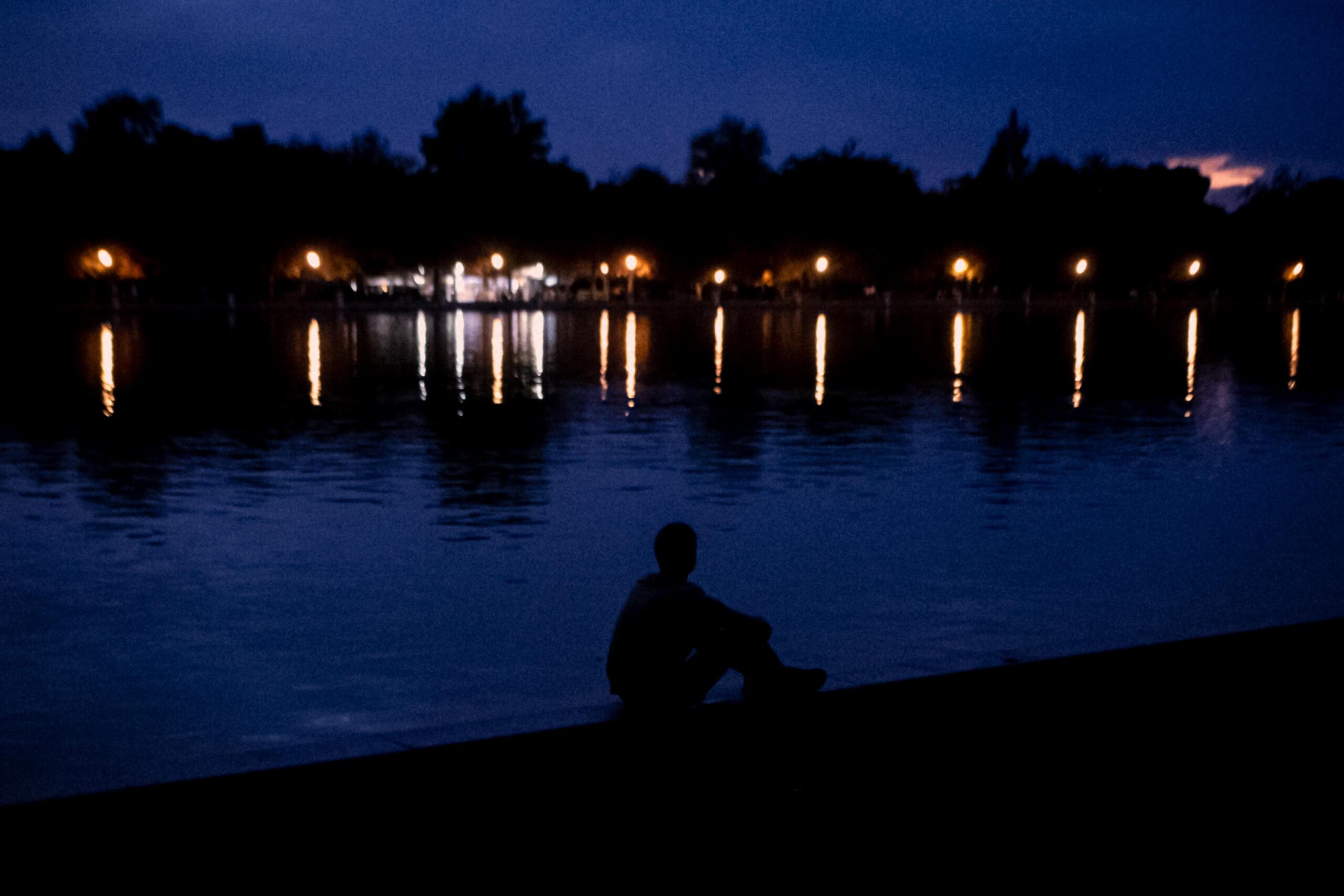 man at lake sunset